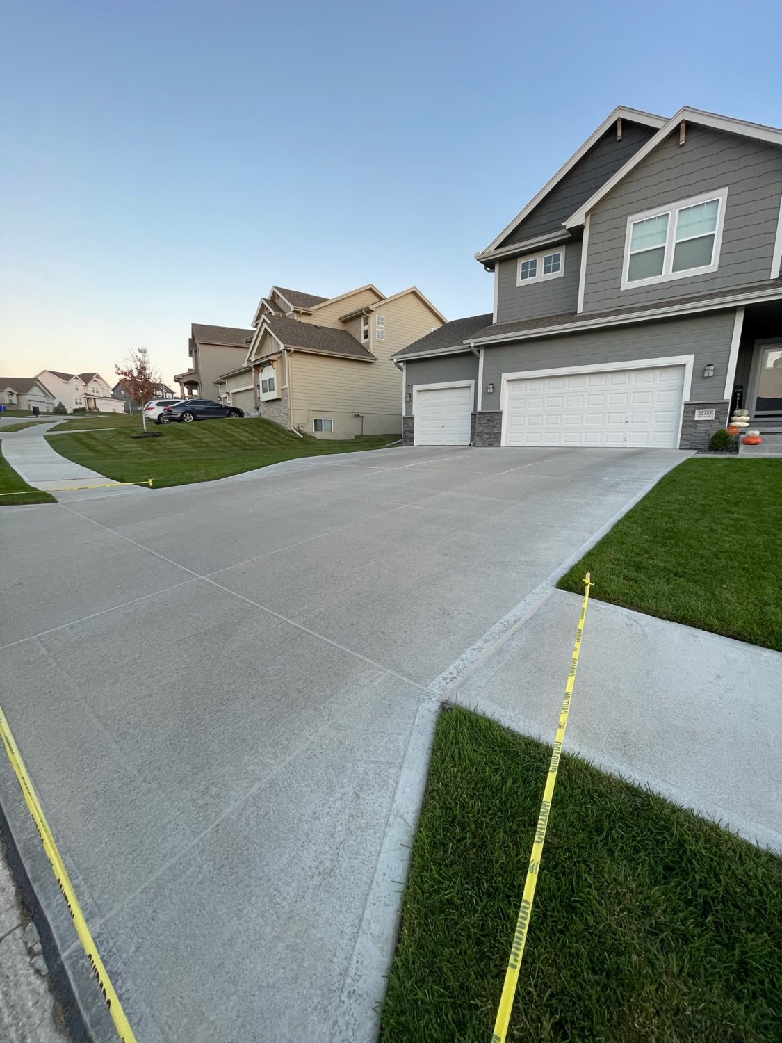 Modern home driveway at sunset